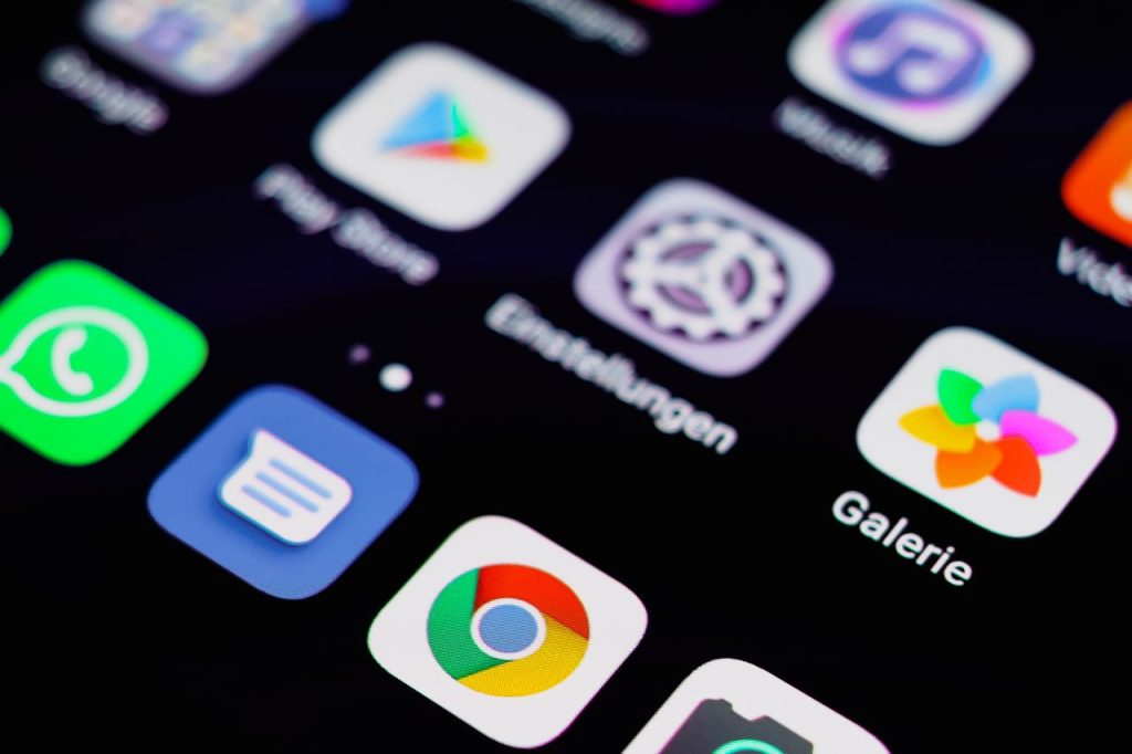 pexels photo 10920328 10920328 Close-up image of a smartphone screen displaying various app icons on a dark background.